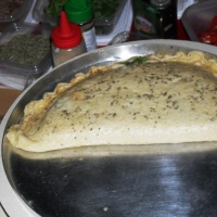 calzone de rúcula com tomate seco qnd pedido é preparado na festa